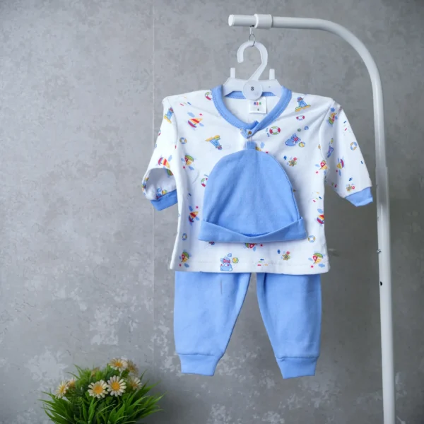 2-piece baby outfit featuring blue pants, printed long-sleeve top, and matching blue hat, neatly arranged on a hanger with a minimalist backdrop.