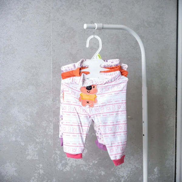 3-in-1 baby trousers set showing pink and white patterned pants with a cute bear patch and colorful accents.