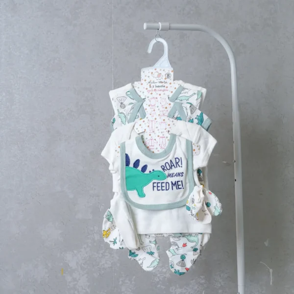 8-piece newborn baby receiving set with dinosaur print and 'Roar Means Feed Me!' bib, in white and green tones.