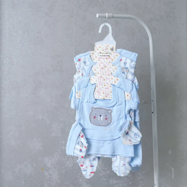 8-piece baby boy receiving set in light blue with bear embroidery, including coordinated bodysuit, bib, mittens, and pants.