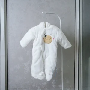 fleece baby romper with hood and animal ears, featuring paw print knee accents, front zipper, and snap-button leg openings, displayed on a flat surface.