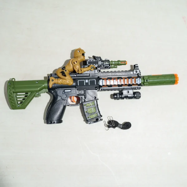 Military-style toy rifle with green and black design, featuring an attached soldier figure, scope, and orange safety barrel for role-playing games